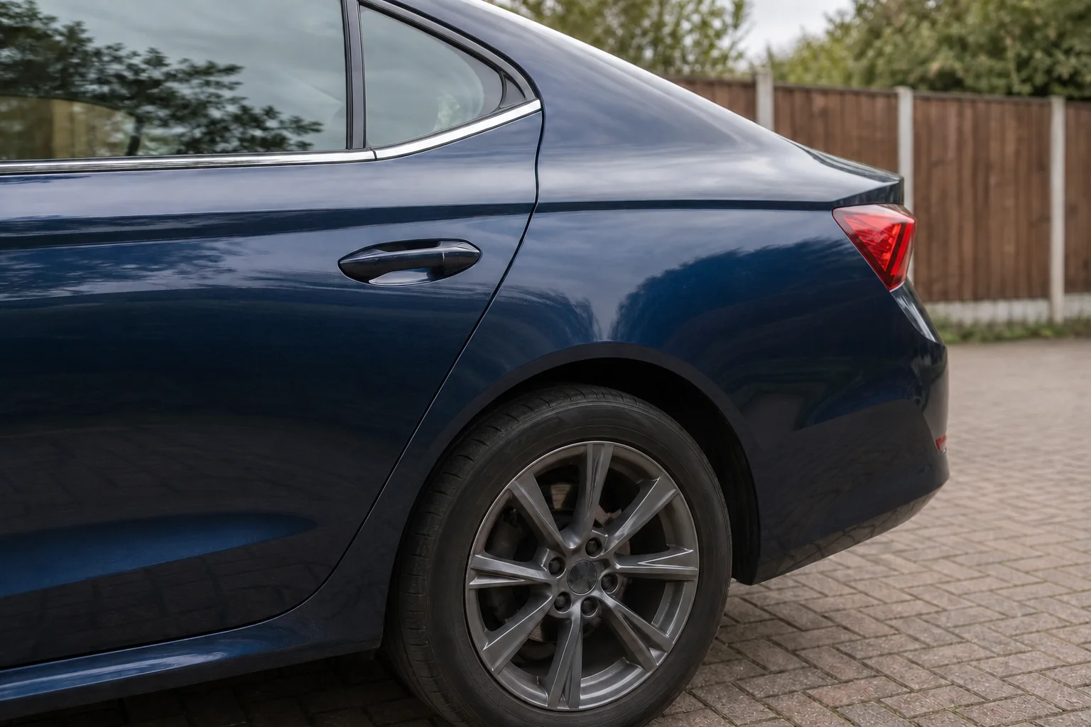 AI demonstration of a professionally repaired blue saloon rear door and quarter panel